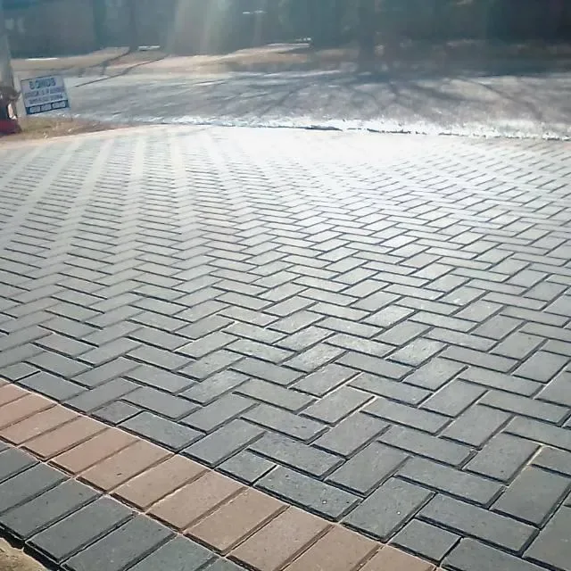Contact Rapid Paving Charcoal and red brick driveway paving laid by Rapid Paving in Johannesburg, Gauteng