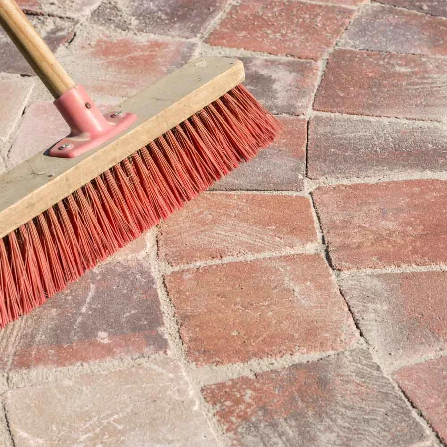 Paving repairs Kiln-dried jointing sand swept between pavers
